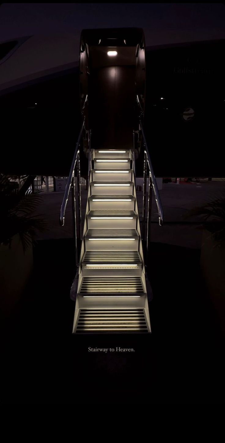 Lighted airstair of a private jet at night